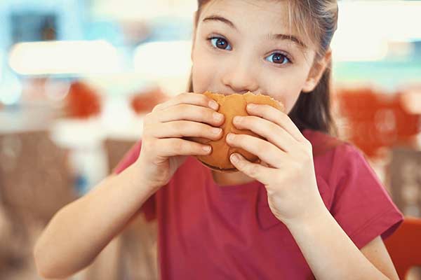 Girl eating burger